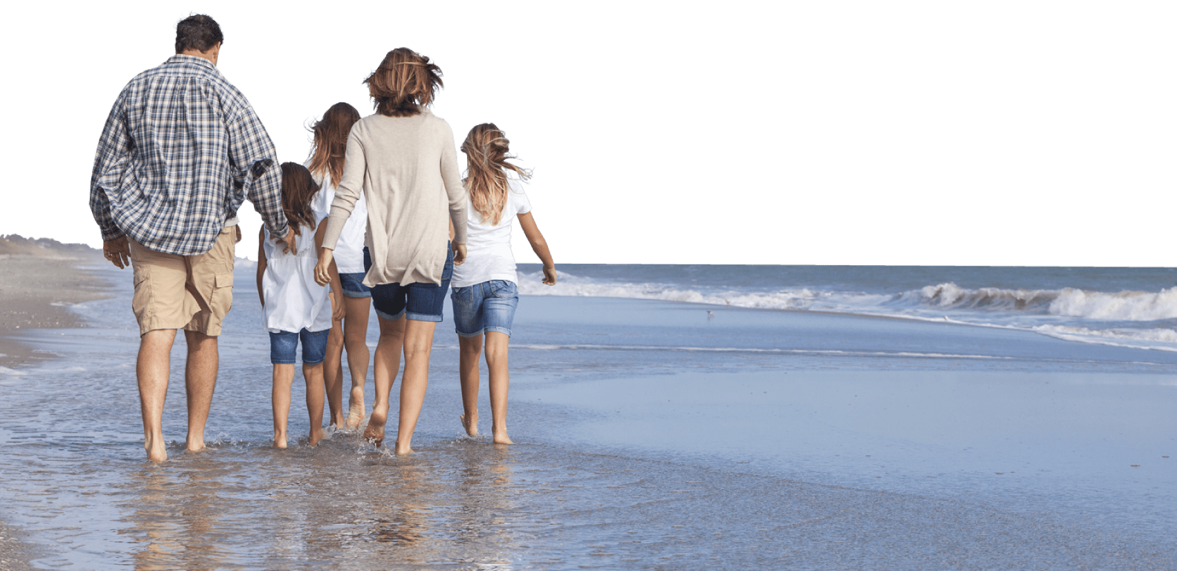 full width image of family walking on the beach